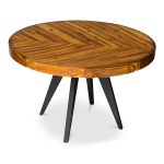 with careful consideration given to the natural variations and final appearance of each individual piece. The table's parquet-patterned top is complemented by elegant